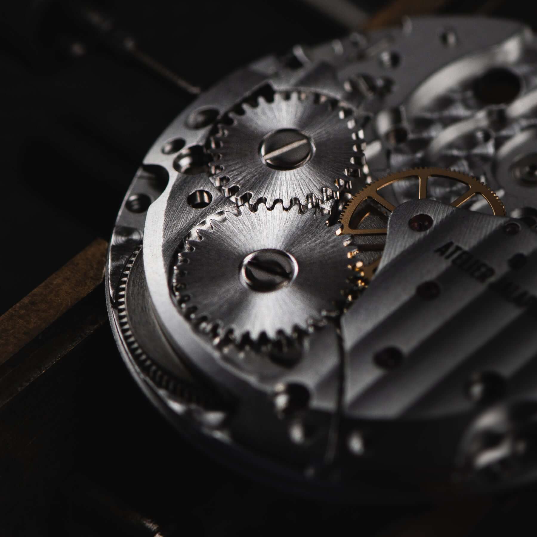 Close-up of an AJ watch movement with its soleillage finish